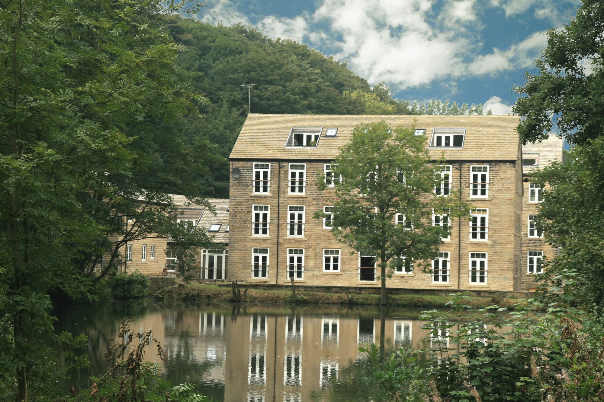 Conversion of a former cotton mill and ancillary buildings into houses and apartments