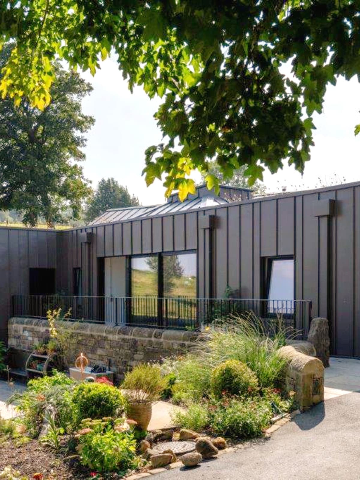 Zinc clad new house in Green Belt and adjacent a Grade II listed building.